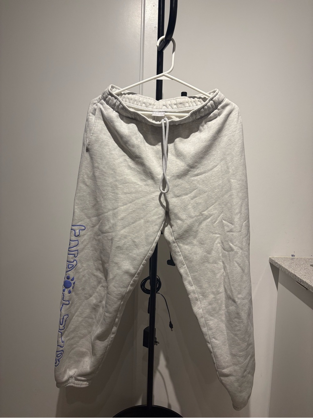 TNA Cream Sweatpants with Blue Side Logo Script
